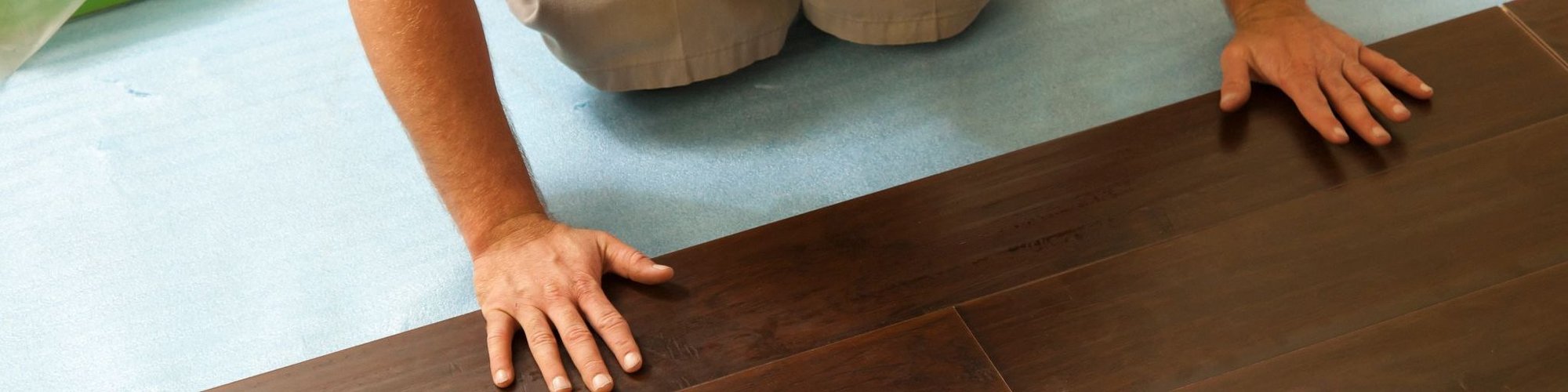 Person Laying Click-Together Wooden Plank Flooring