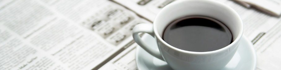 Coffee Cup On Newspaper