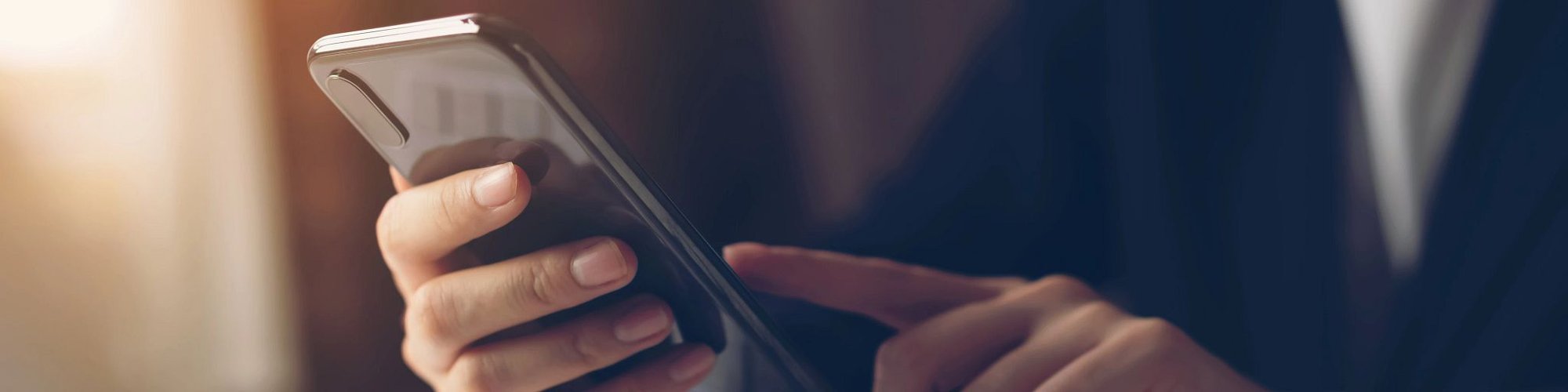 man holding phone - Tymeless Flooring in Slidell, LA